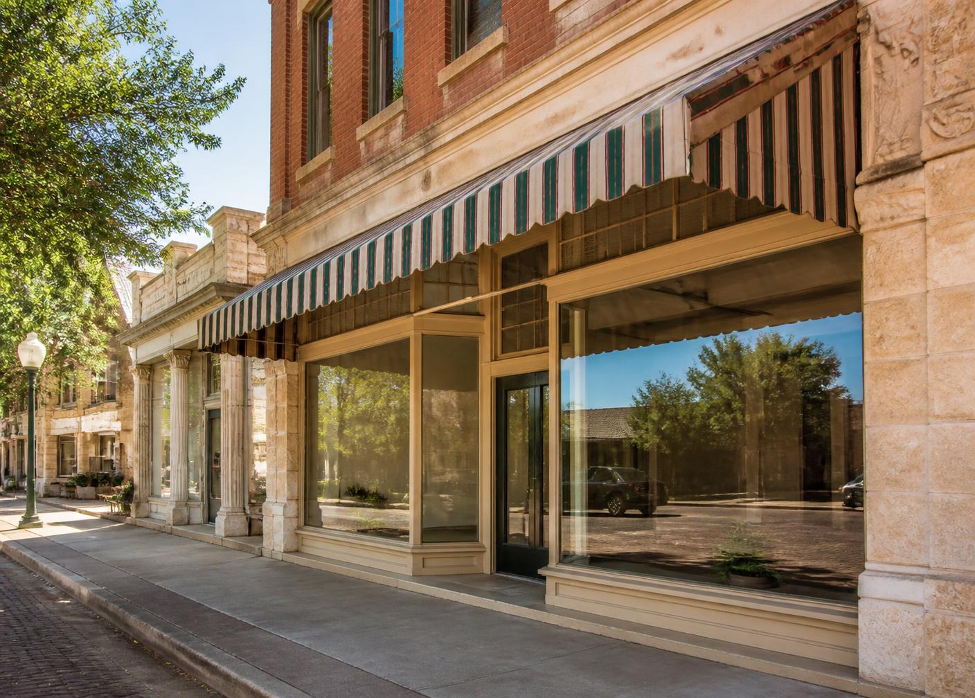 Historic storefront with large display windows on the Granbury town square